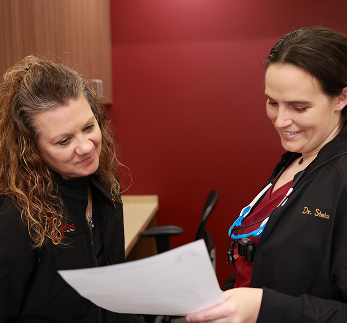 Two team members looking at paper