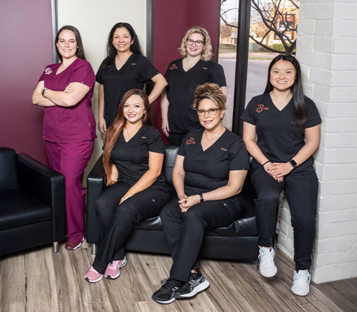 Rockwall dental team members gathered in office and smiling